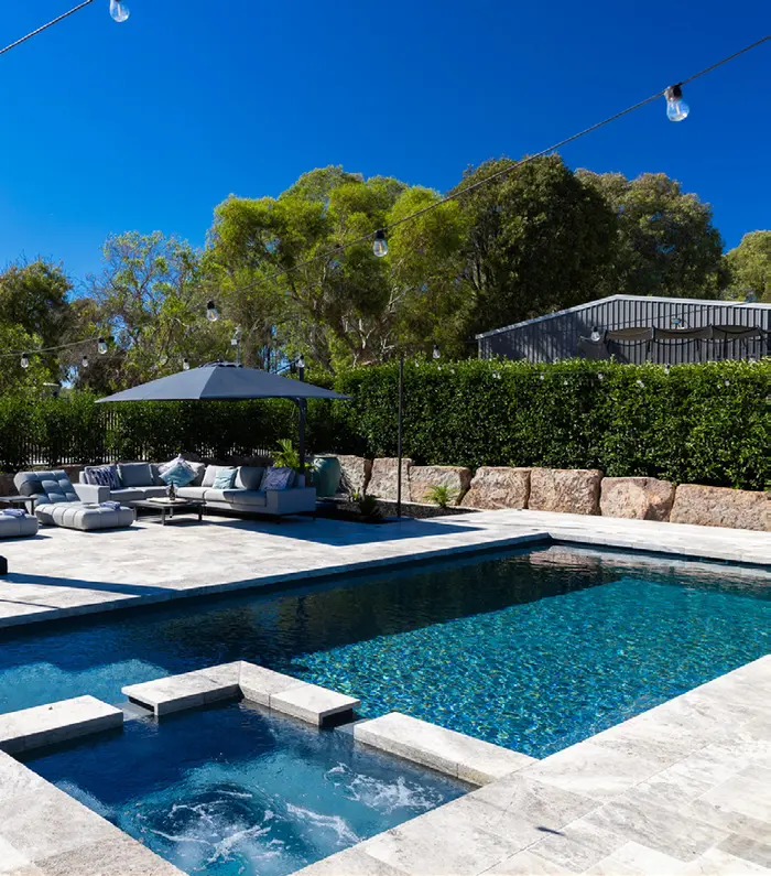 A GV Unique pool and spa with landscaped garden beds