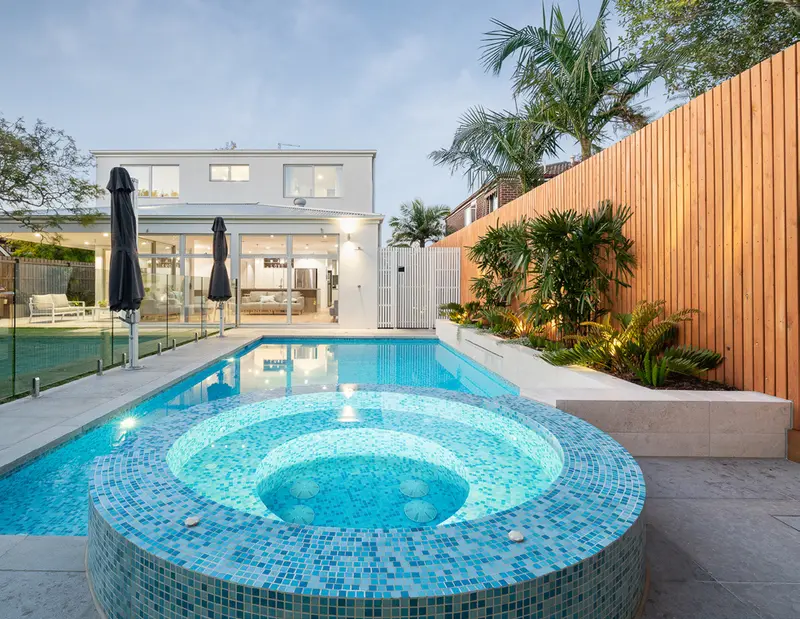 A Tanzanite pool with a round spa